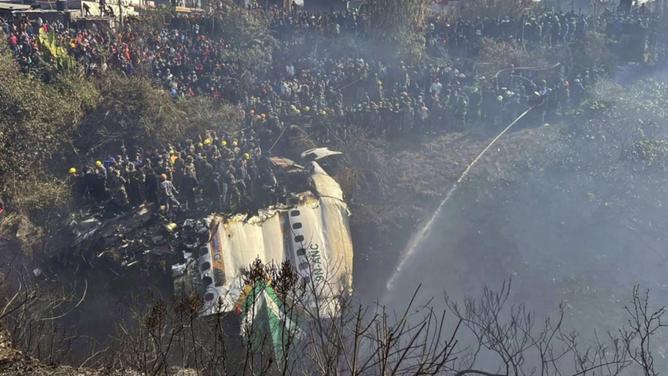 A Yeti Airlines plane carrying 72 people has crashed on a hillside in Pokhara, Nepal. (AP PHOTO)