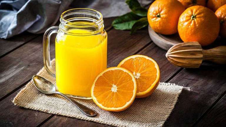 Uống nước cam hằng ngày có đẹp da? Những lợi ích bất ngờ và tác dụng phụ đáng chú ý của nước cam - 1