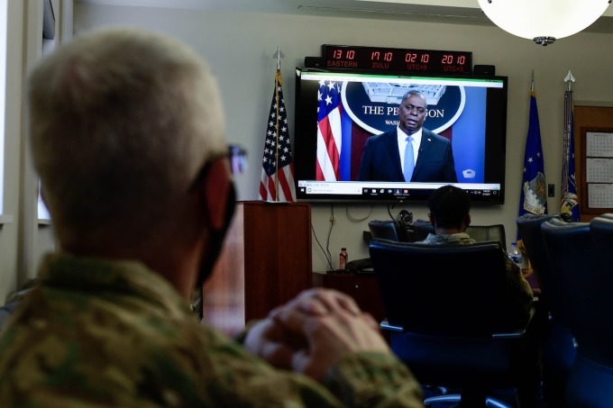 Air Force personnel watched then-Defense Secretary Lloyd Austin address the issue of extremist ideology within the military during a base-wide pause in training in 2021. Photo: Tech. Sgt. Jeffrey Grossi/U.S. Air Force