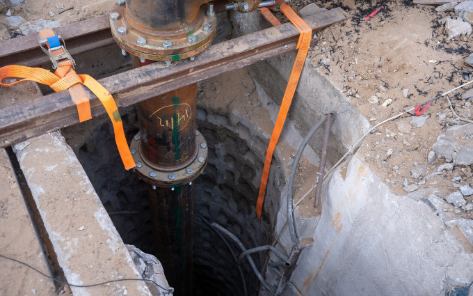 A pipe pumping water into a Hamas tunnel is seen near Palestine Square in Gaza City’s Rimal neighborhood, December 19, 2023. (Emanuel Fabian/Times of Israel)