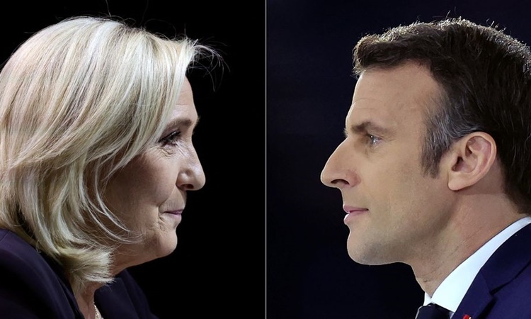 Lãnh đạo đảng cực hữu Mặt trận Quốc gia Marine Le Pen (trái) và đương kim Tổng thống Pháp Emmanuel Macron. Ảnh: Reuters.