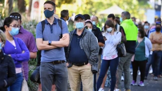 A queue outside a new mass COVID-19 vaccination hub in Sydney.