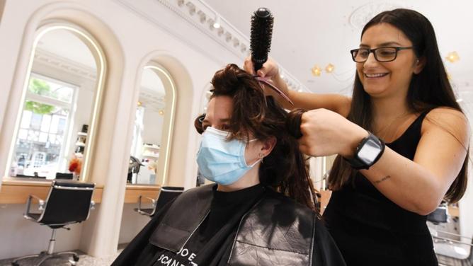 Attracting and keeping workers is a major challenge across all sectors, including hairdressing. (James Ross/AAP PHOTOS)