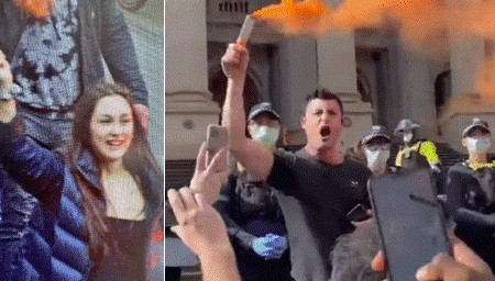 A man and a woman holding a flare