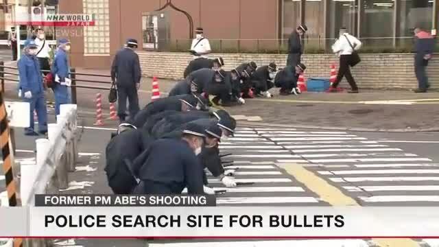 Investigators search site of Abe's shooting for bullets