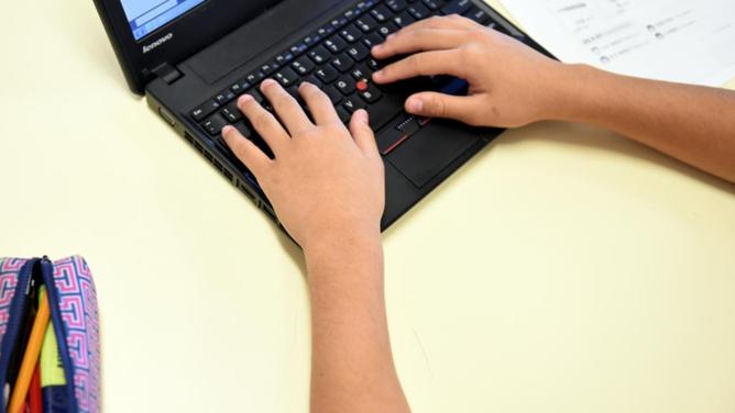 Hundreds of children have reported being targeted by nasty comments or offensive pictures online. (Paul Miller/AAP PHOTOS)