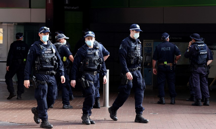 Cảnh sát tuần tra đường phố Sydney, Australia, hôm 30/7. Ảnh: AFP.