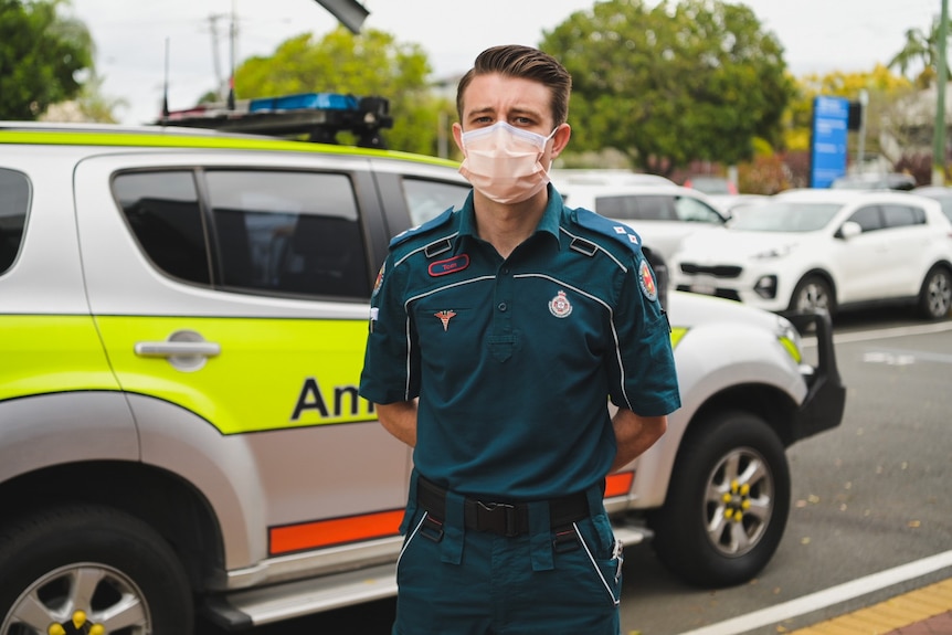 Tom Holland stands in front of ambulance.
