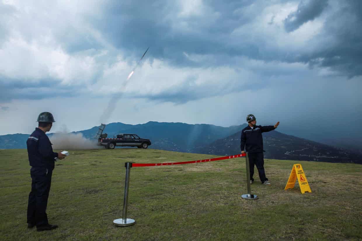 Staff members carry out artificial rain seeding operations as part of the drought relief measures amid a heatwave warning in Zigui county of Yichang, Hubei province, China August 16, 2022. China Daily via REUTERS ATTENTION EDITORS - THIS IMAGE WAS PROVIDED BY A THIRD PARTY. CHINA OUT.