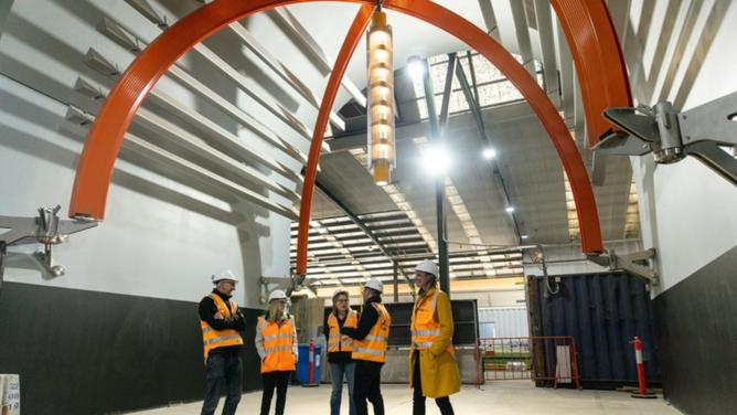 Transport Infrastructure minister Jacinta Allan (centre) was shown around a prototype Metro station. (Diego Fedele/AAP PHOTOS)