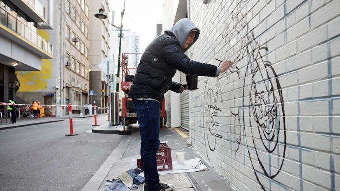 Shawn-Lu-working-on-his-artwork-in-Langs-Lane-photo-by-Nicole-Reed