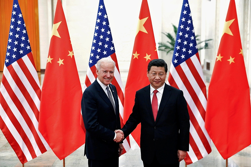 Ông Joe Biden (khi là Phó Tổng thống Mỹ) và ông Tập Cận Bình trong cuộc gặp năm 2013. Ảnh: Reuters