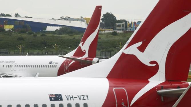 Qantas has upgraded its interim profit outlook for the first half of the financial year. (AP PHOTO)