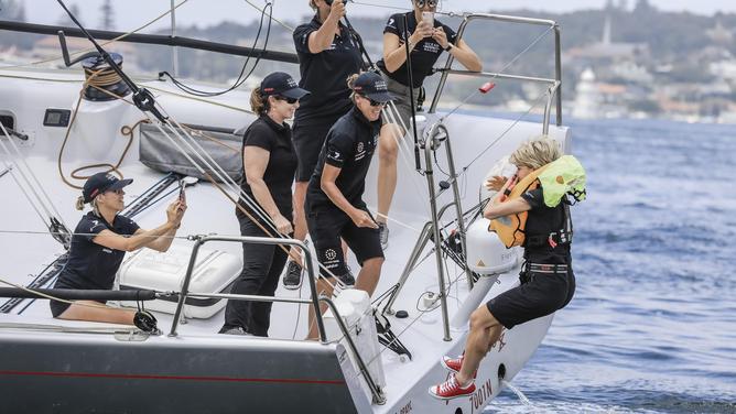 Former foreign affairs minister Julie Bishop jumps off the back of the 66 footer at Bondi Beach.