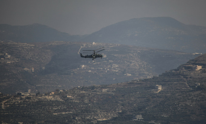 Máy bay quân sự Nga di chuyển vào căn cứ không quân Hmeimim ở Latakia, Syria ngày 15/12. Ảnh: AFP