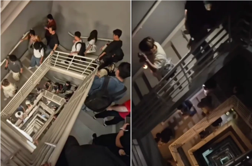 Hàng trăm nhân viên đi xuống 100 tầng khi thang máy ngừng hoạt động tại tòa nhà  The Exchange 106 , Malaysia, chiều 15/10. Ảnh: Brian Lee/Facebook