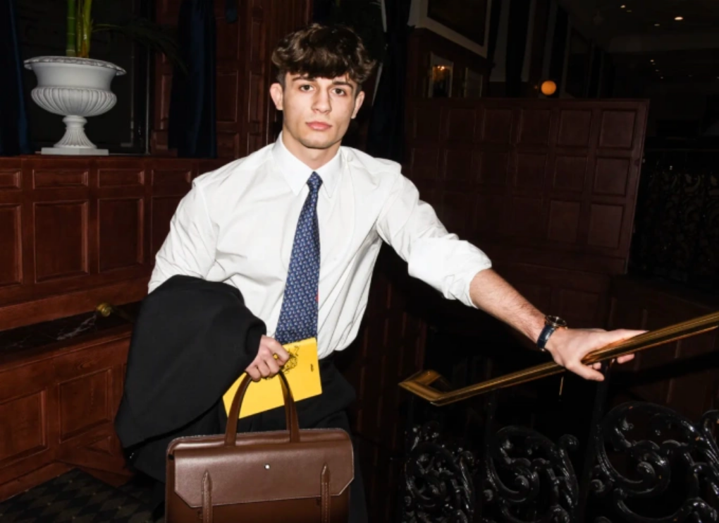 Mason Clarke, 24 tuổi, bị chỉ trích bởi diện vest Celine, cà vạt Hermès, đồng hồ Omega và túi Montblanc trong bộ ảnh với tạp chí Interview. Ảnh: NY Post